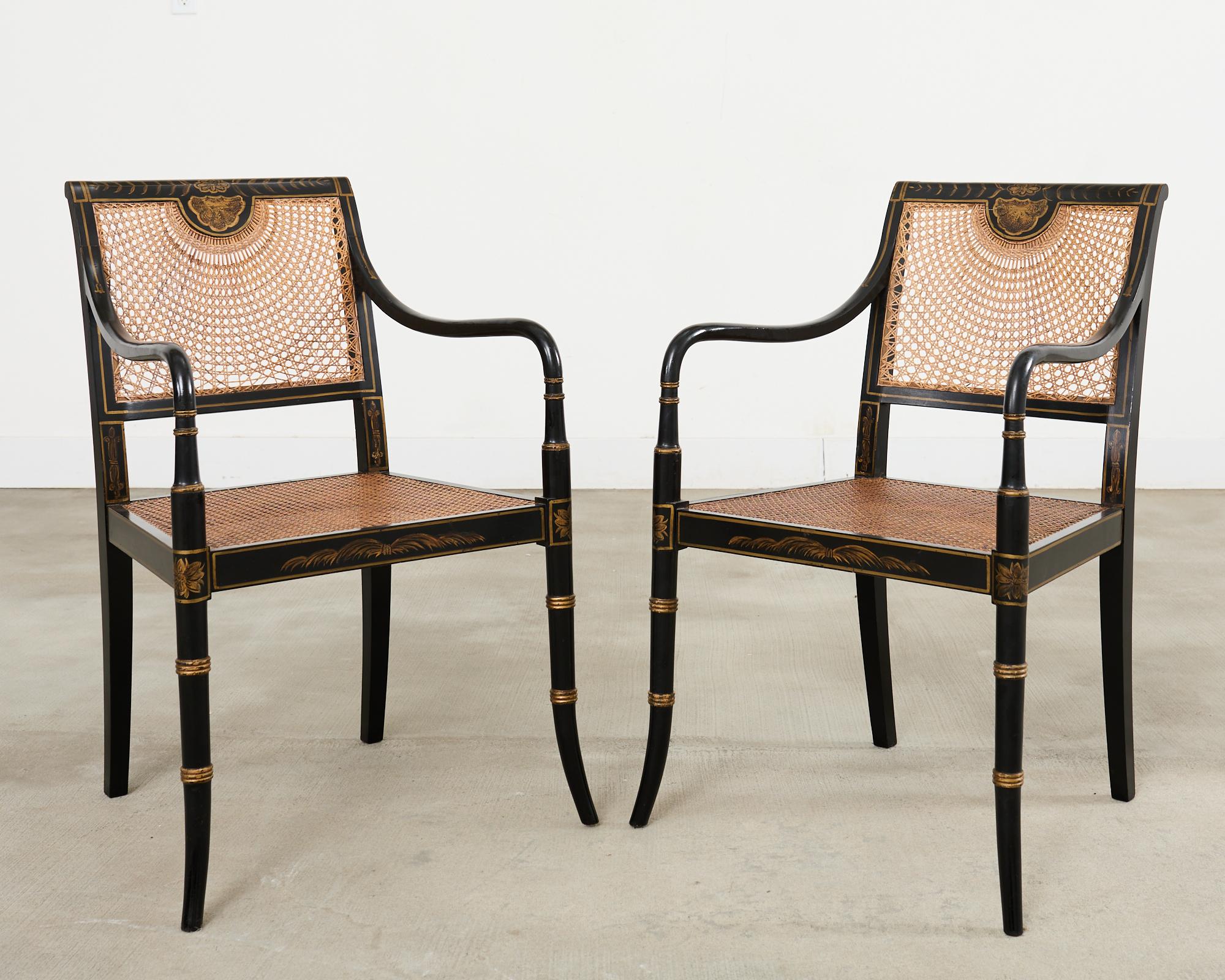 Lacquered Pair of English Regency Style Ebonized Caned Elbow Chairs For Sale