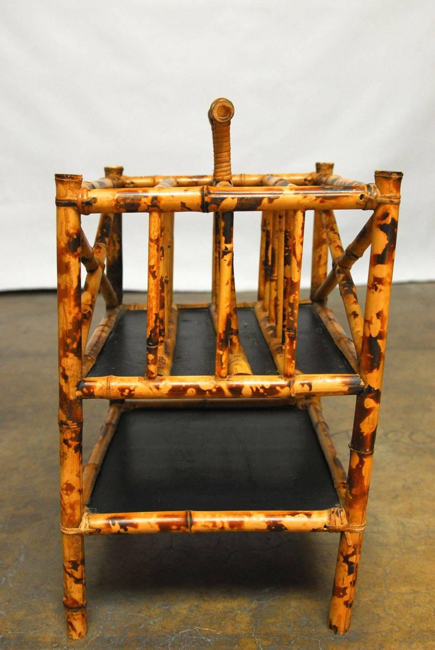 Gorgeous scorched tortoise shell pattern bamboo is featured on this canterbury. Hand-bound with split cane fibers and black lacquered wood panels on the two tiers. Front and back have contrasting X-formed sides.