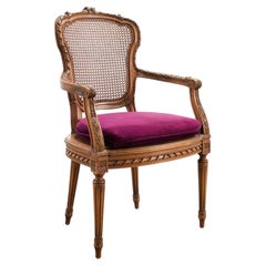 French Louis XVI Style Carved Walnut Cane Fauteuil Armchair