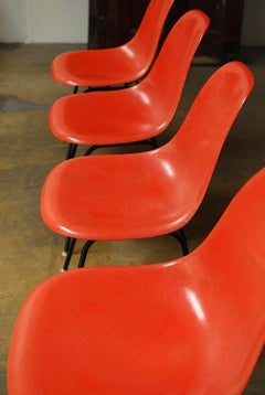 Set of Four Mid-Century Miller Eames Orange Fiberglass Shell Chairs