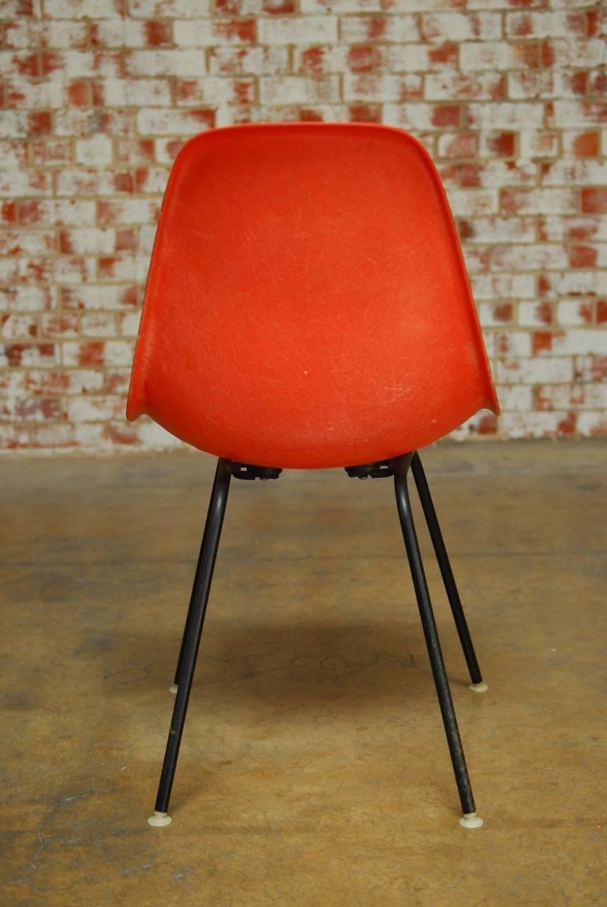 American Set of Four Mid-Century Miller Eames Orange Fiberglass Shell Chairs