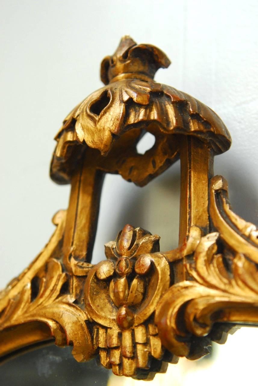 Italian Carved Giltwood Oval Pagoda Mirror In Fair Condition In Rio Vista, CA