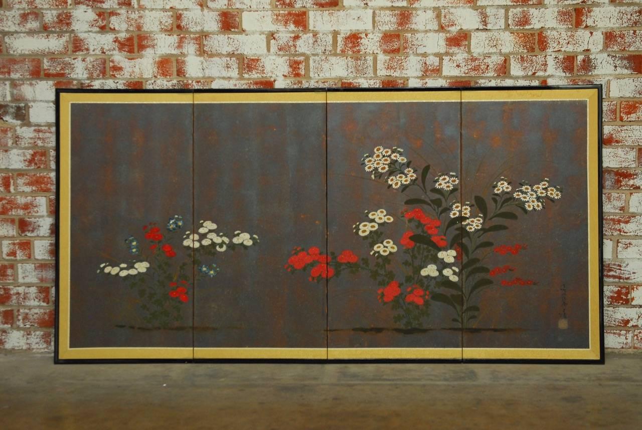 Stunning Japanese four-panel folding byobu screen depicting hand-painted flowers on an unusual metallic dark background. The screen has an almost iron metal patina that makes the contrasting bright flowers seem to come off the paper. Bordered by a