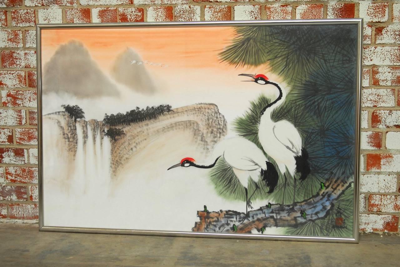 Two cranes original water color painting on silk by Poon Tai To (b. 1946 Chinese). Traditional Chinese bamboo brushwork of an idyllic Asian landscape with two birds. Painted similar to an Audubon print with painstaking detail. Mounted in a silver