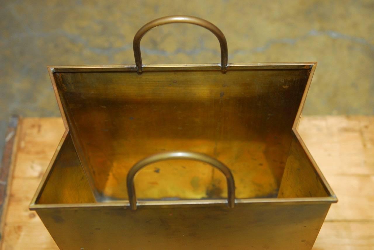 Fabulous Gio Ponti attributed brass shopping bag magazine holder or wastepaper basket. Features a brushed finish with a rich brass patina. Stamped "Made in Italy" on bottom. This magazine rack or trash can would also polish to a bright