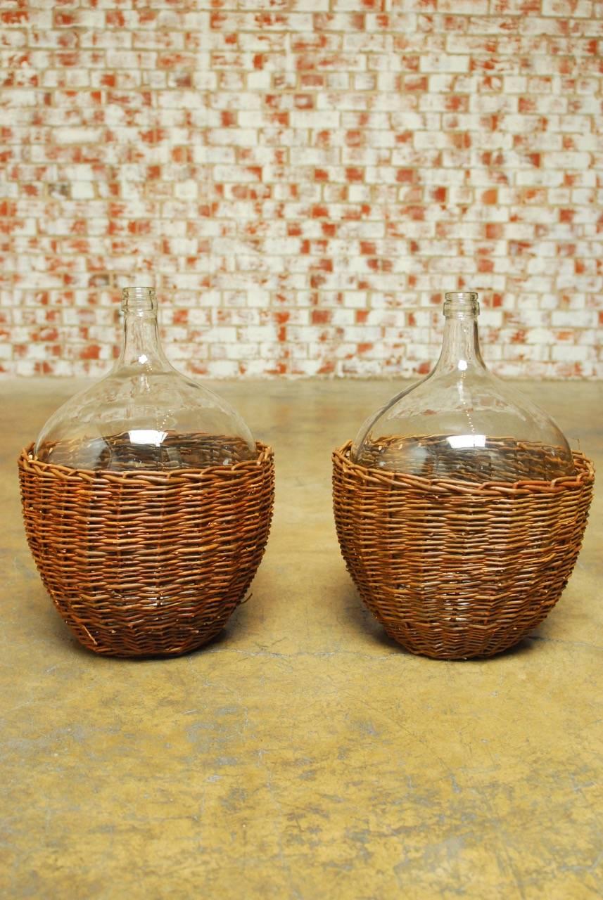 Contemporary Pair of Woven Willow Demijohn Glass Wine Bottles 