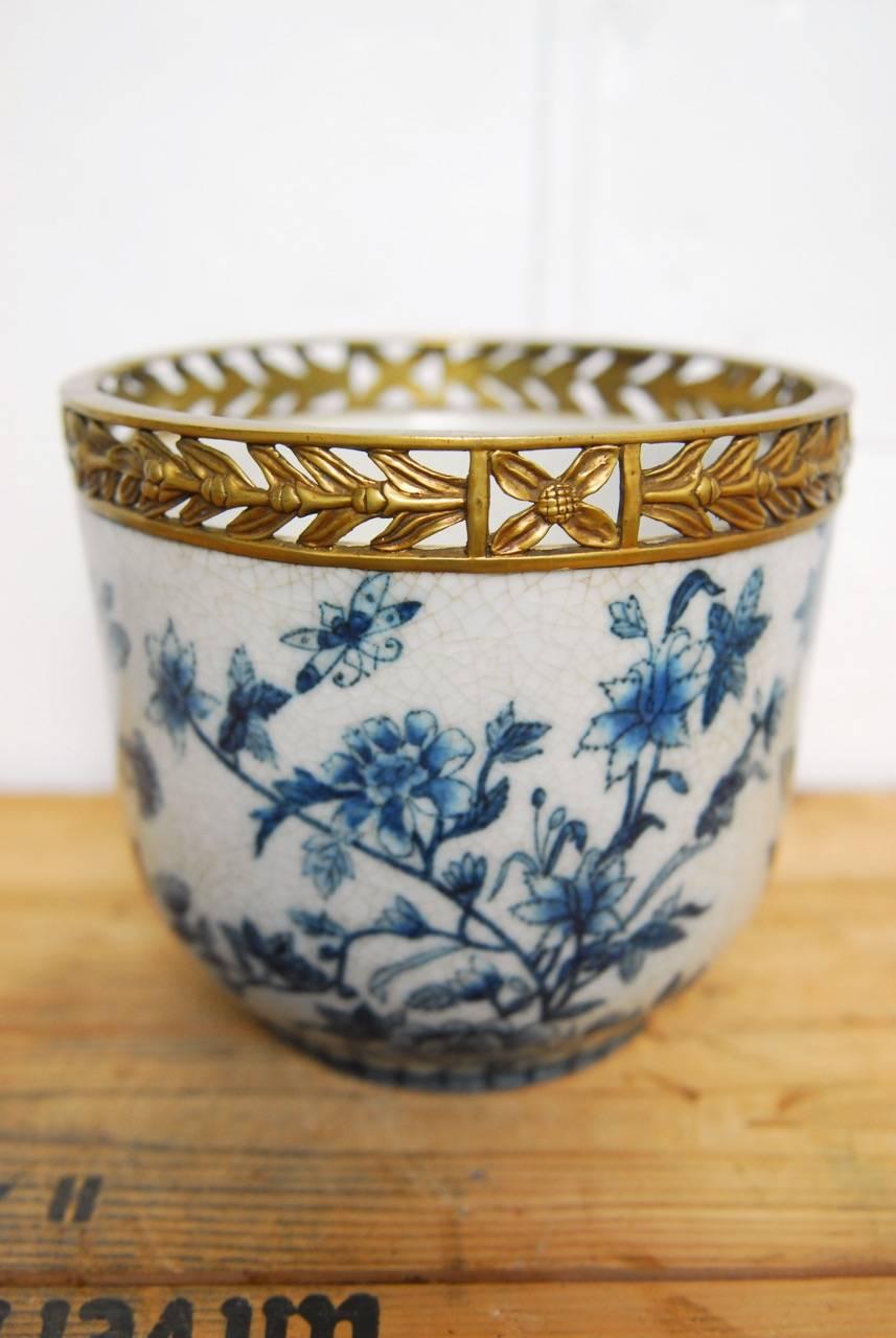 Hand-Painted Set of Three Chinese Brass Mounted Blue and White Porcelain Urns