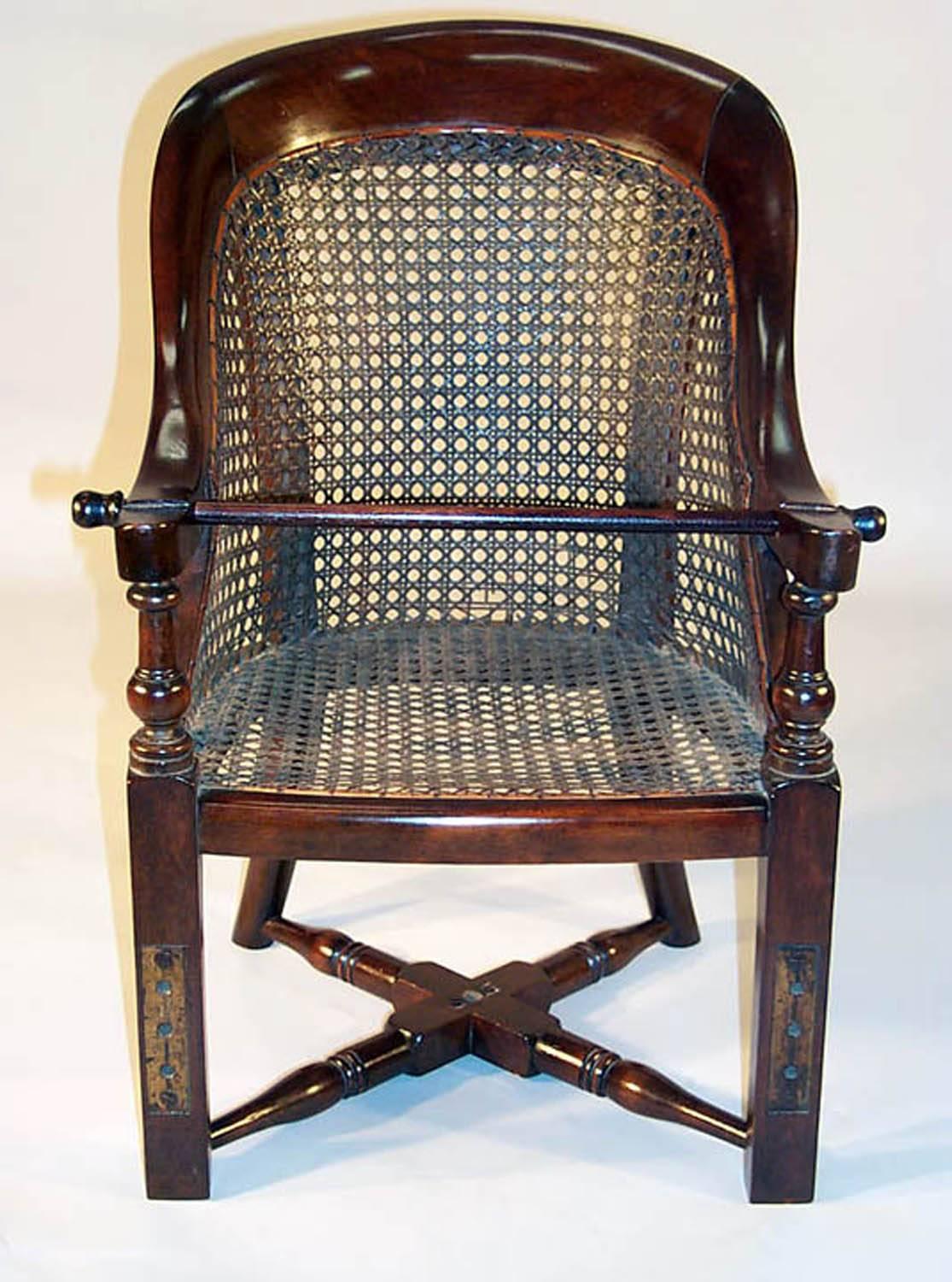 Antique English Regency style child's high chair in mahogany with caned seat and back, with turned cross stretcher on a detachable stand with turned front legs and canted tapered rear legs. The chair and stand can be used independently, late 19th