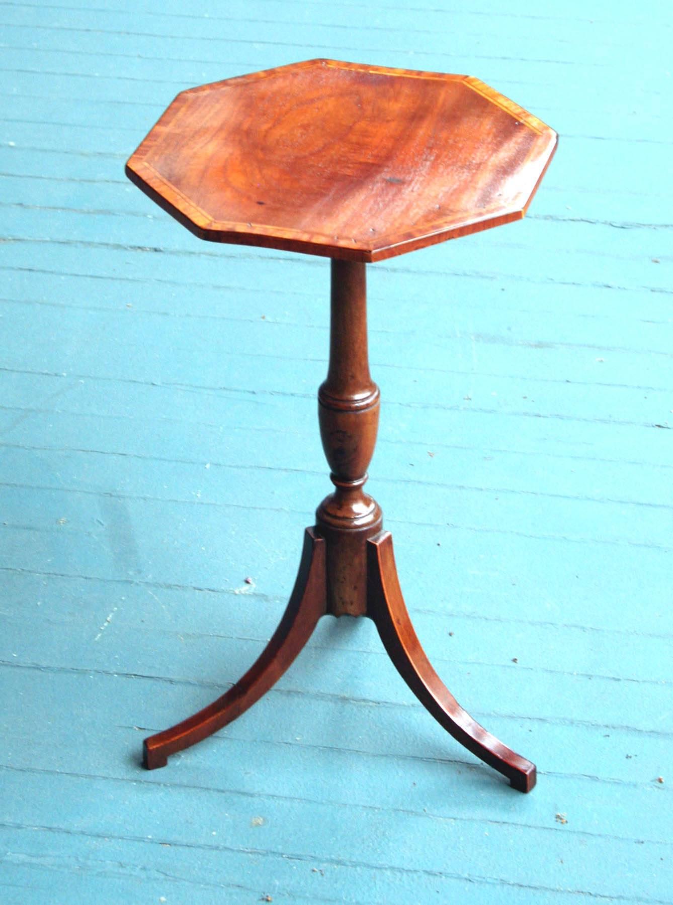 Extremely rare small Sheraton wine table having an octagonal mahogany top banded in satinwood above a vasiform turned pedestal and supported by three downswept legs with satinwood stringing. Most tables of this form described as 