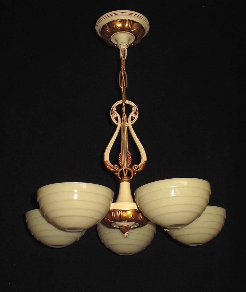 If you love Mid-Century design but sometimes find it lacking in humanity or beauty this is for you!
 Great transition piece from Art Deco to Mid-Century Modern. Refinished in it's original colors of cream and antique golden. The five Mid-Century