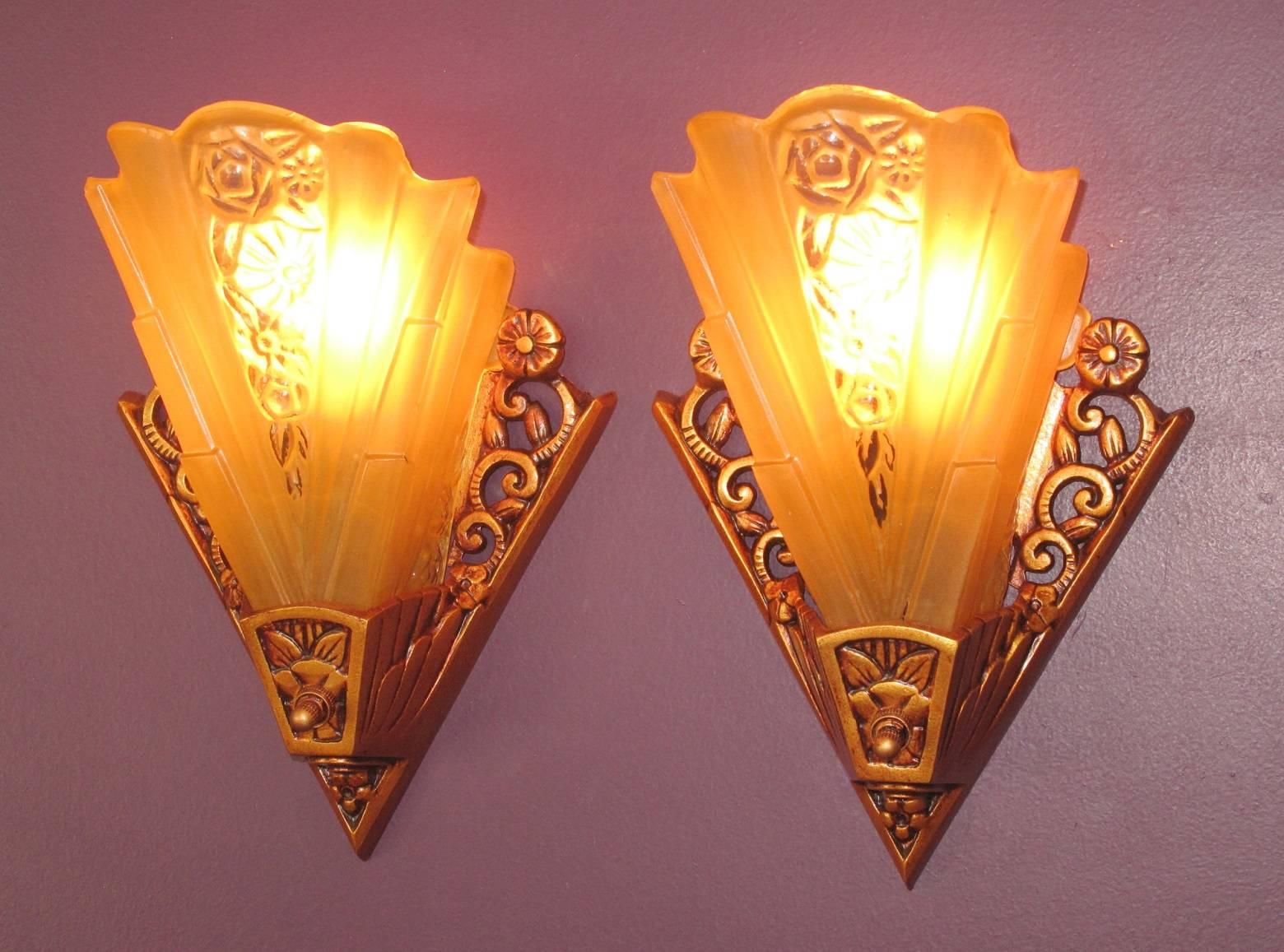 Fully engulfed Art Deco! 
Possibly more than one pair available, please check for availability.
 With an Art Deco influence, these are right at home in any Bungalow setting, living room, or dining room; we have even placed these in several baths