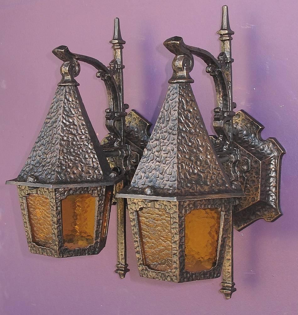 One of our favorite 1920s-1930s vintage porch lights. Great European inspired styling that the Romantic era was known for, with intricate casting in aluminum and a hammered finish throughout. Honey colored pebble glass have been replaced so all the