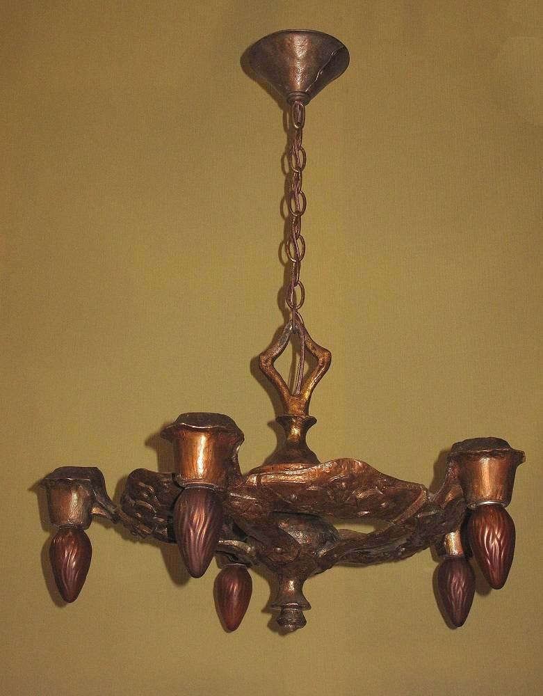 Known for their organic shapes and forms, many of the fixtures from CB Rogers show the happy marriage between Art Nouveau, the Arts and Crafts movement and the Mediterranean revivals (Spanish Revival et all). This is not an exception. 
Signature in