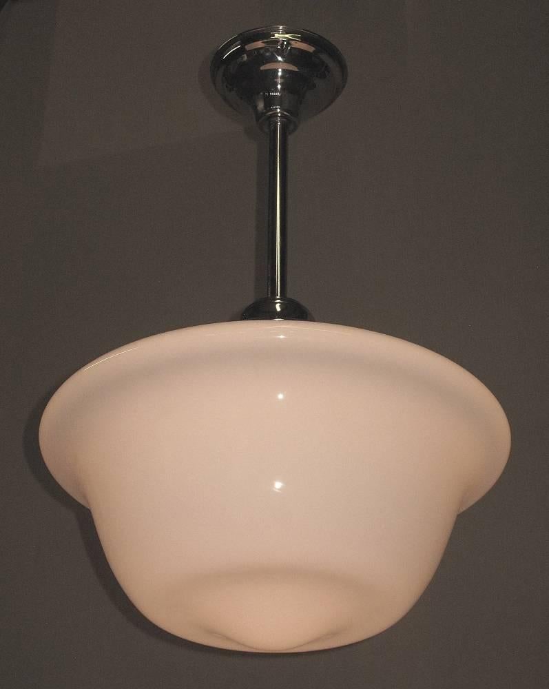 Two available priced each.
With one of the more pleasing profile, this 1920s shade is 16 inches across. Shown on new polished nickel fitters which can be adjusted to your required length.
Can handle up to 250 watts each.
