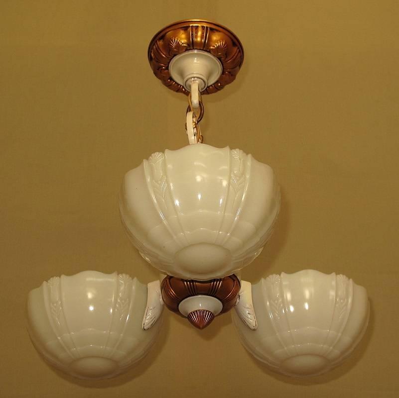 Three matching available.
Restored to its original colors of cream and antique golden. This three-shade fixture imparts the refined style of yesteryear's designers. Shades are of high quality 
