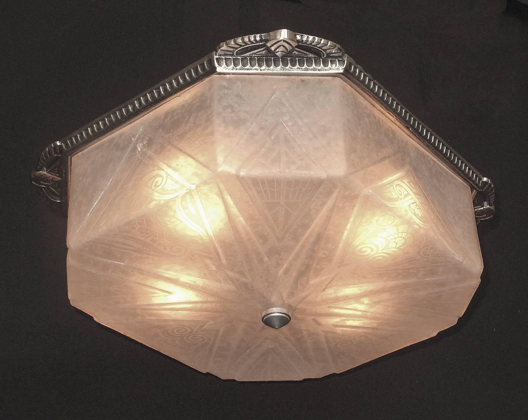 Two available priced each.
Similar to the glass found in the Oviatt Building in Downtown LA by Lalique these are from an old Art Deco Theater in West Virginia. Late 20s flush mount fixture with 4 sockets. The wonderfully designed glass is deeply