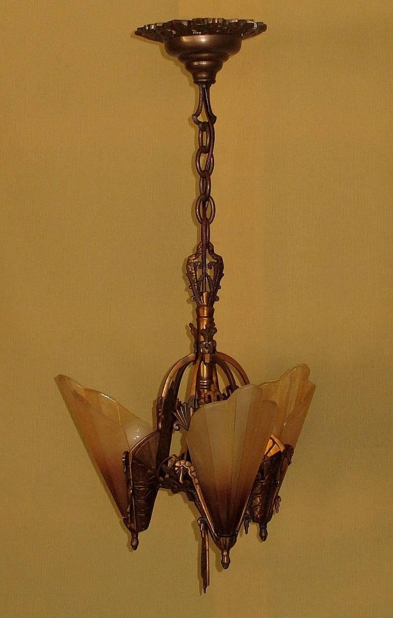 This series of solid bronze fixtures from the Midwest Chandelier Co. are often called the epitome of American Art Deco design. Highly detailed bronze castings are flawlessly executed in Art Deco designs and the 