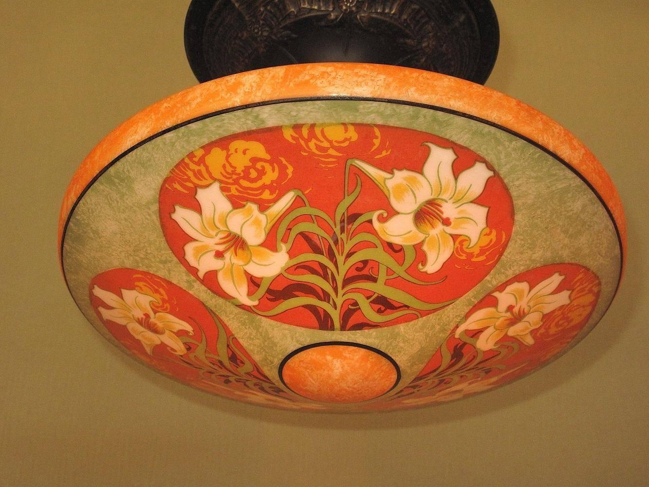 Three beautifully executed medallions of white Asian lilies set against an orange background with clouds also in the Asian fashion. The green leaves of the lilies are set against a shadow of the leaves creating a feeling of depth in the painting.