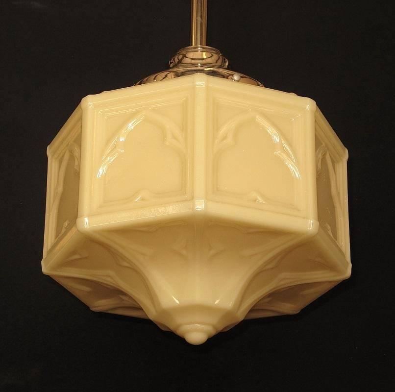 Custard glass shade in the neo-Moorish revival vein. Each of the eight side and bottom panels have a trefoil design with a raised window tracery in each of the eight-side panels. Moorish revival was very popular in the mid-1900s and also saw an