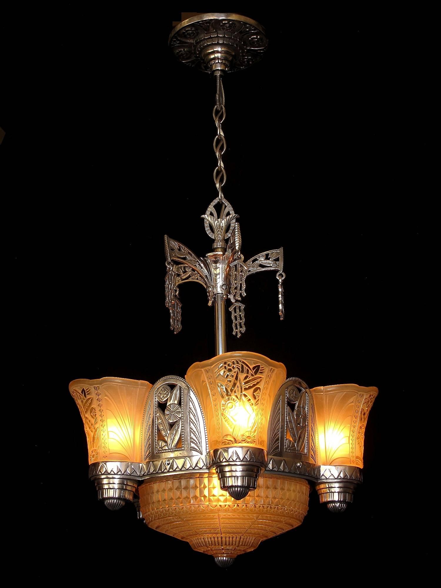 Fabulous example of the powerful artistry design found in Art Deco design in the late 1920s. And rare. In 20 years I can remember only seeing one of these chandeliers complete and this is it. Looks like it could be the home version of a massive