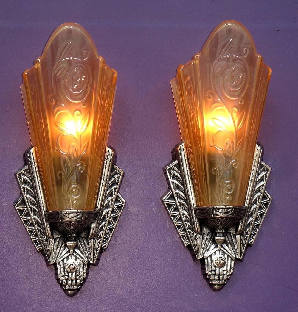 Priced per pair.
Classic Art Deco design. There is so much wonderful detailing on the base that at first glance the base looks too small for the shade until your eyes grab the full depth and breadth of the intricate designs, giving way to the