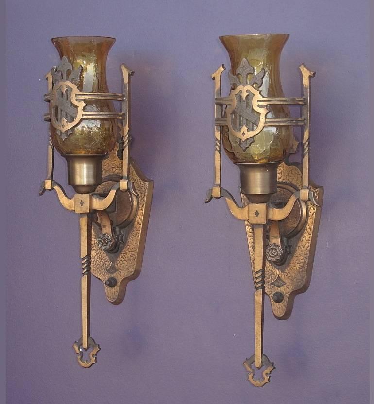 As seen in the Mid-West chandelier's 1928 catalog is this wonderful set of solid bronze vintage wall sconces with crackle glass shades. Original finish and patina which has been gently cleaned and lightly waxed. 60 watt max. 

Measures: Height: 16