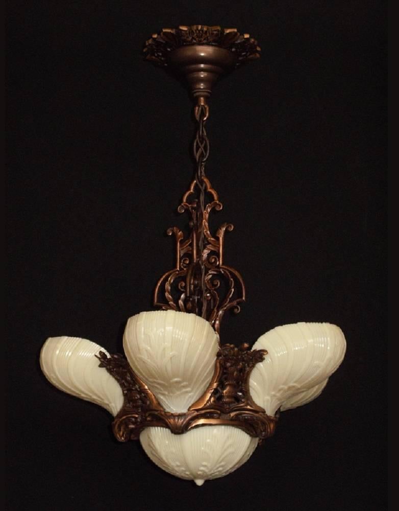 One of the rare American masterpieces in this genre of vintage lighting fixtures. It captures the extravagance and beauty of the Roaring 1920s (although possibly made in the early 1930s). This six shade version, which includes the matching bottom