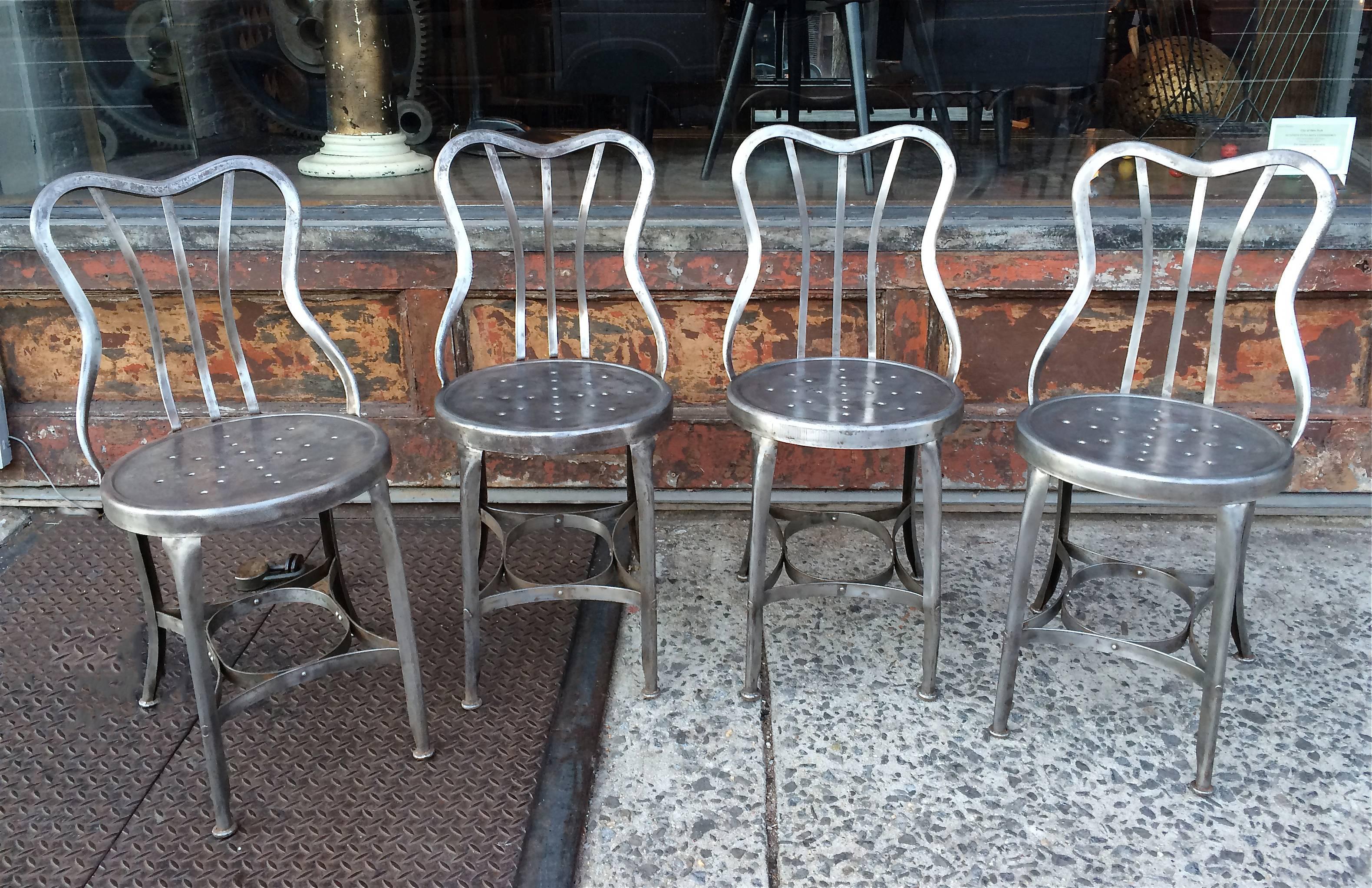 Pair of industrial, brushed steel, café chairs by Toledo Metal Furniture Co. 