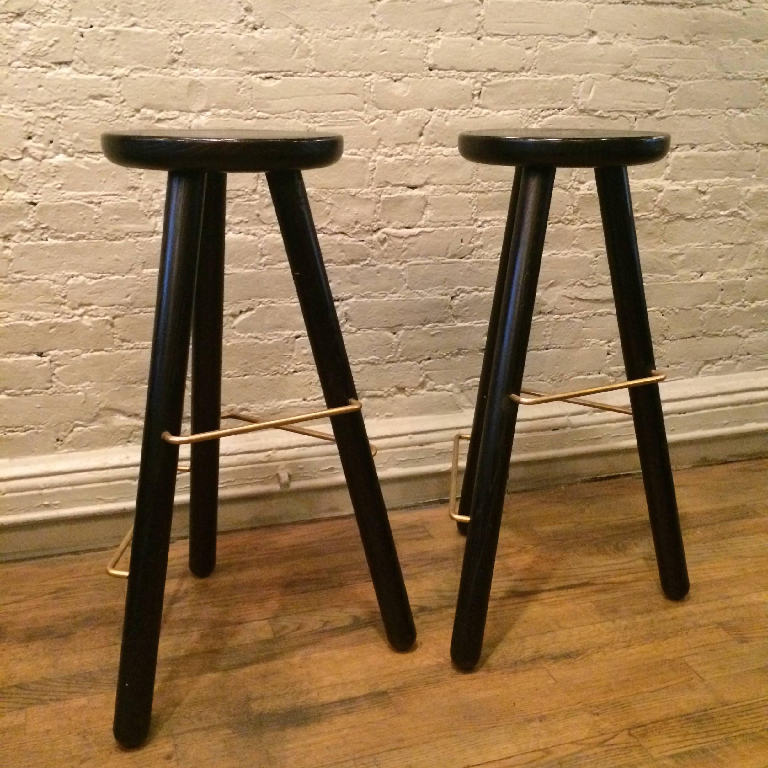 Contemporary, modernist, limited edition, ash wood bar stool in an ebonized finish with three graduated, brass footrest hand-crafted in the UK, only one available.

Measure:30