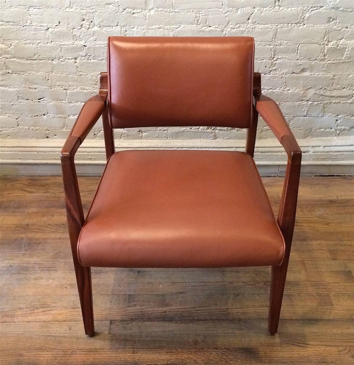Mid-Century Modern, solid walnut armchair by Jens Risom with seat, back and arms, newly upholstered in a rich cognac leather.