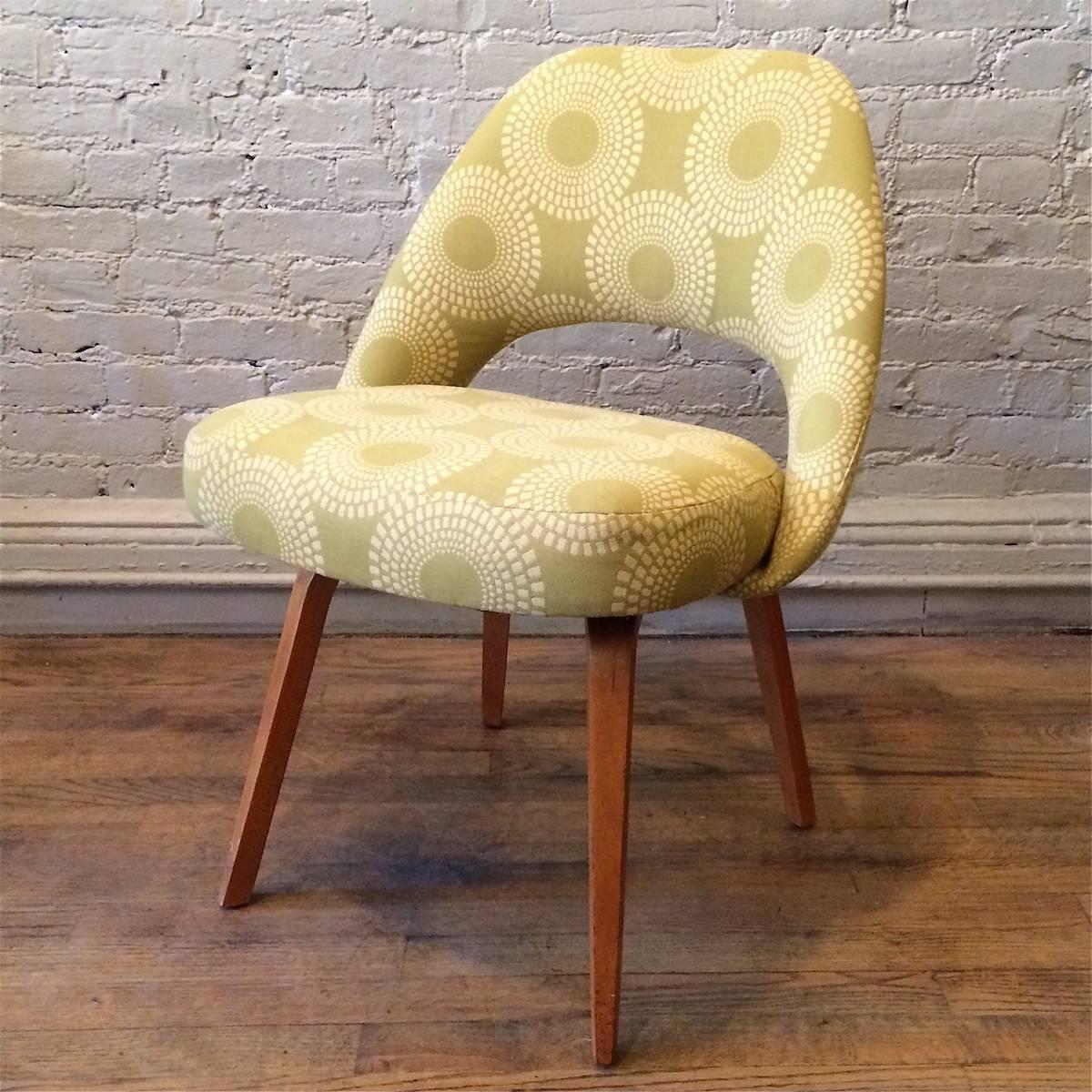 Executive side chair by Eero Saarinen for Knoll with wood legs is newly upholstered in a yellow cotton print.