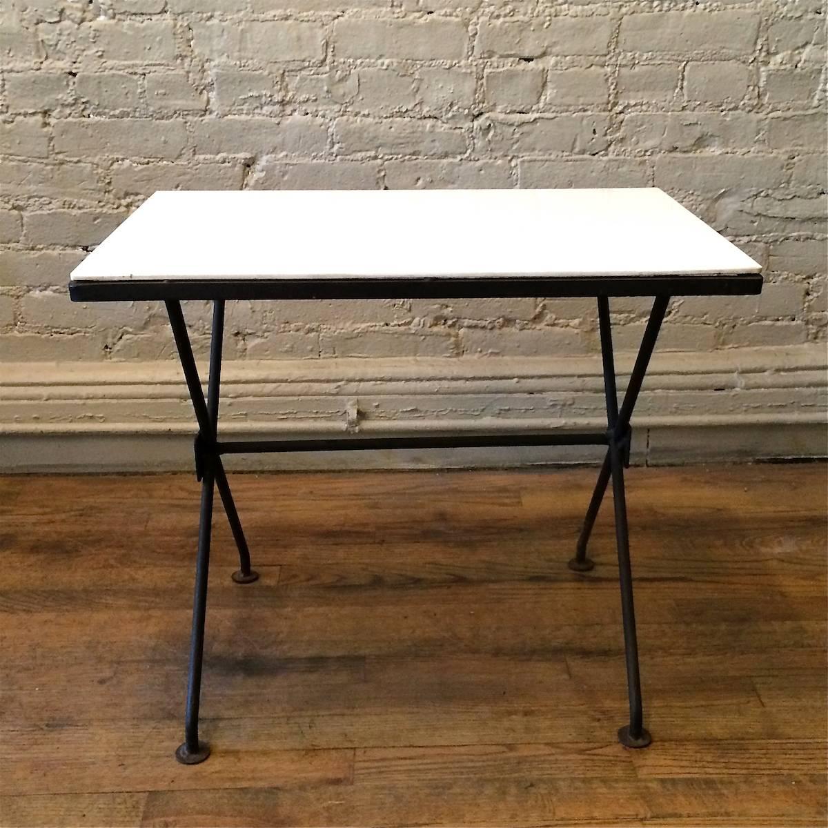 Mid-Century Modern side/occasional table with wrought iron X-base and milk glass top.