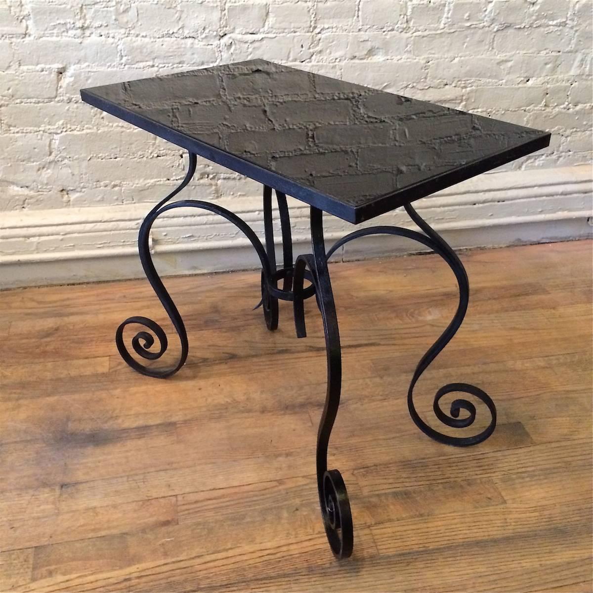 American Hollywood Regency Scrolled Wrought Iron and Black Vitrolite Side Table