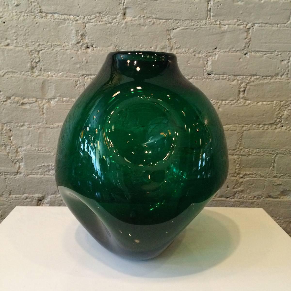 Impressively large, mid century modern, emerald green, dimpled, art glass vessel by Winslow Anderson for Blenko.