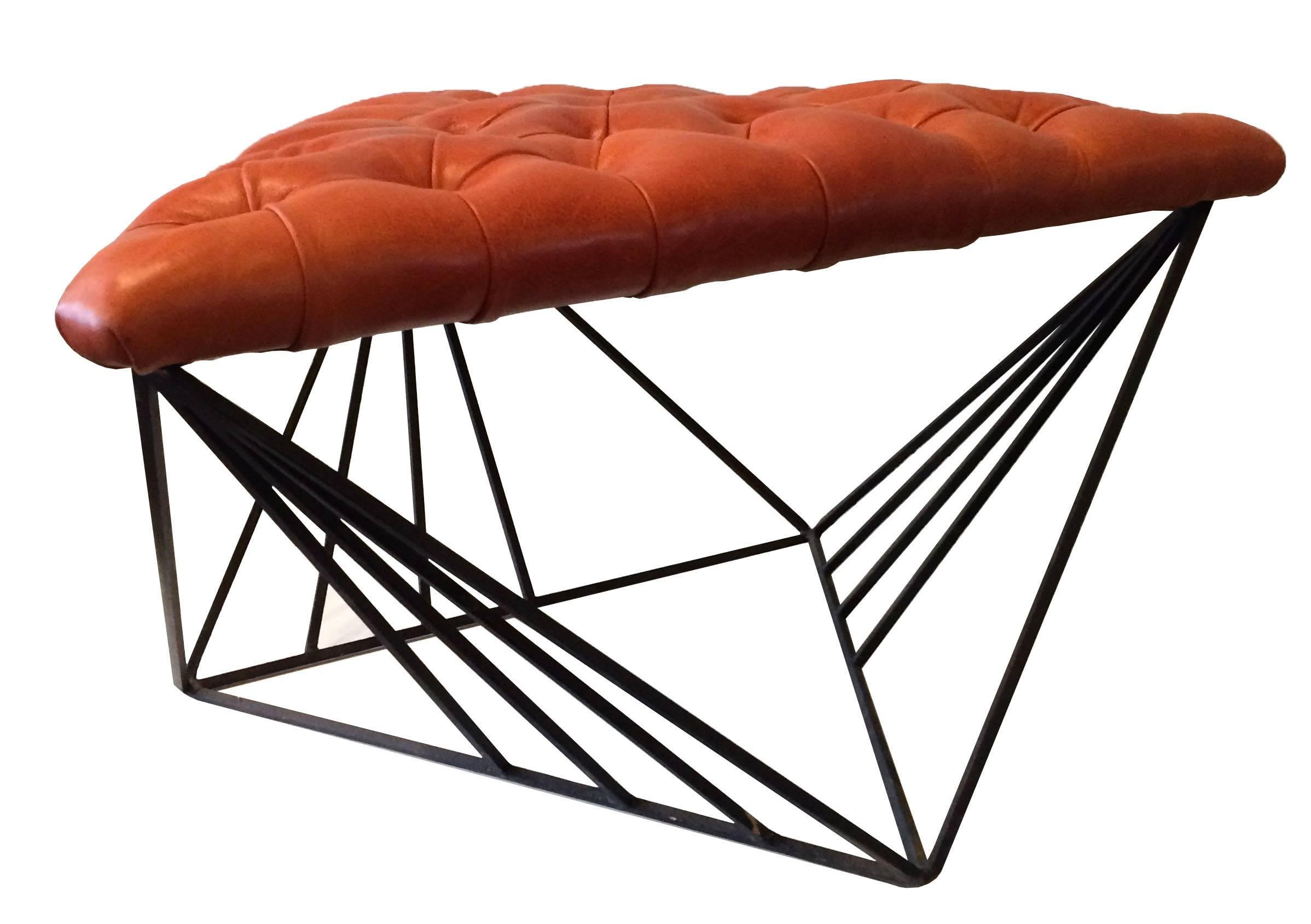 Modernist ottoman with striking, geometric, wrought iron base with newly upholstered, triangular, tufted leather seat.