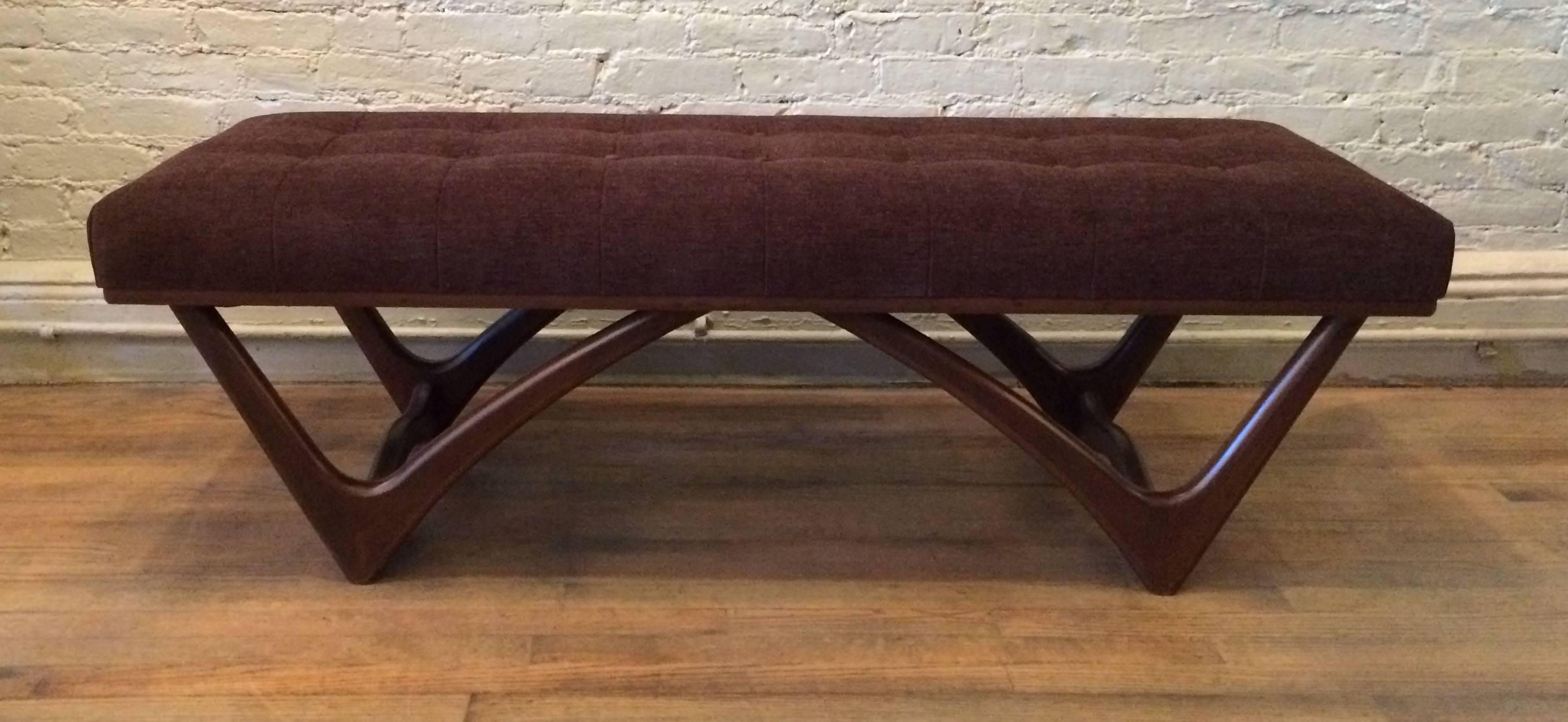 Mid-Century Modern bench in the style of Adrian Pearsall with sculpted walnut base and button upholstered seat in a rich chocolate brown chenille.