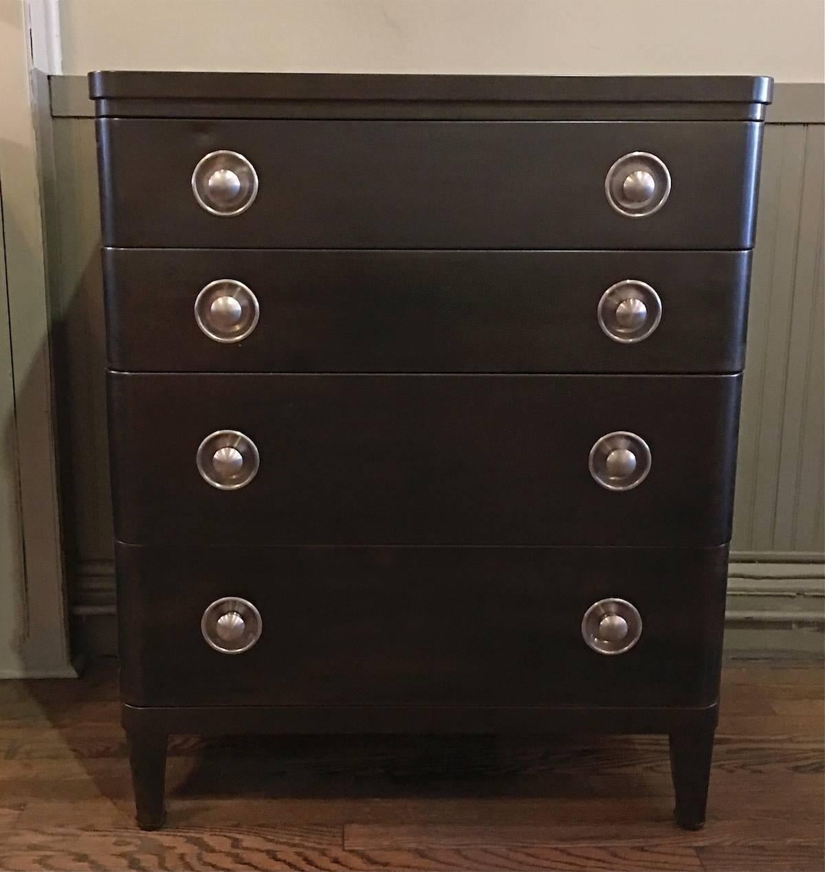 Art Deco, machine age, 1940s, steel, highboy dresser by Norman Bel Geddes for Simmons furniture company in a gunmetal finish with contrasting, recessed brushed steel pulls.