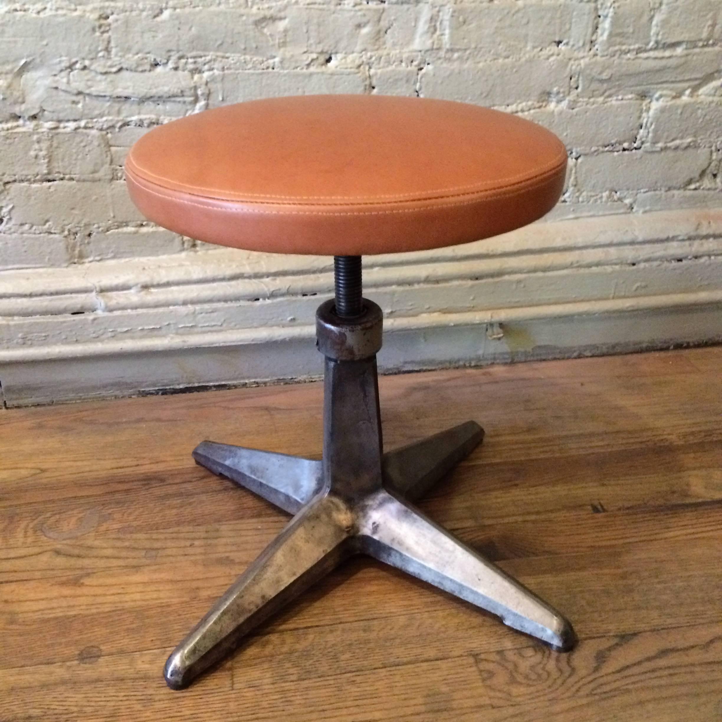 Pair Of Industrial Cast Iron Adjustable Stools with Leather Seats In Excellent Condition In Brooklyn, NY