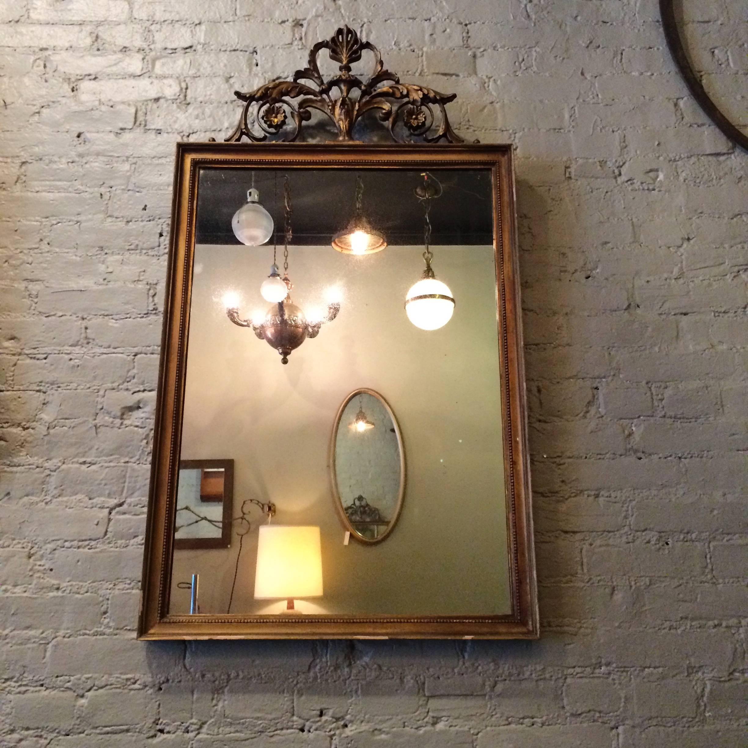 French Regency style, gilt wood, picture frame mirror with plumed top detail.