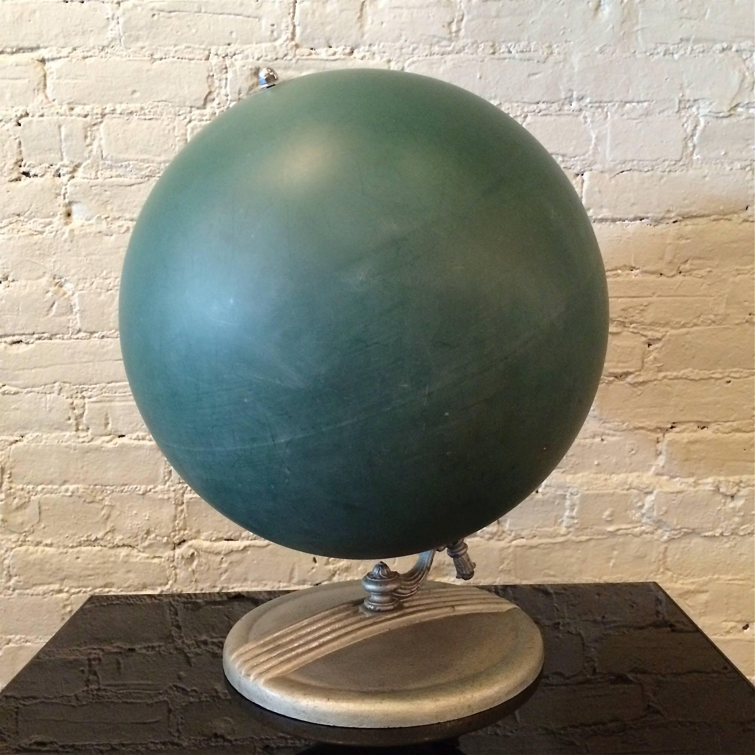 Unusual, tabletop, chalk globe, circa 1940s with green composite surface and decorative cast zinc base.