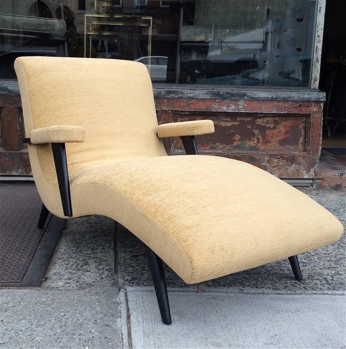 Mid-Century Modern, curvaceous chaise longue in the style of Adrian Pearsall with black lacquered maple frame is newly upholstered in a butterscotch chenille.