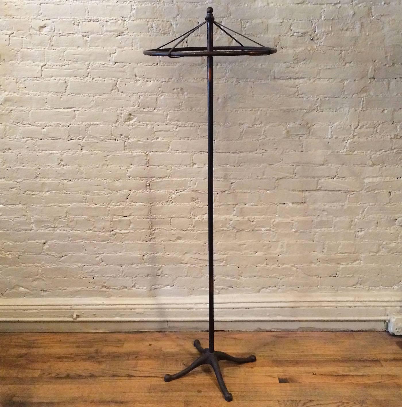 Early 20th century, Industrial, Japanned steel, rounder rack with cast iron base is a rare, smaller scale made for lingerie.