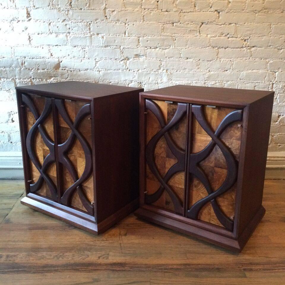 Pair of impressive, Hollywood Regency nightstands or end tables with burl olive wood parquet facades beneath raised, hand-carved walnut flourishes.
