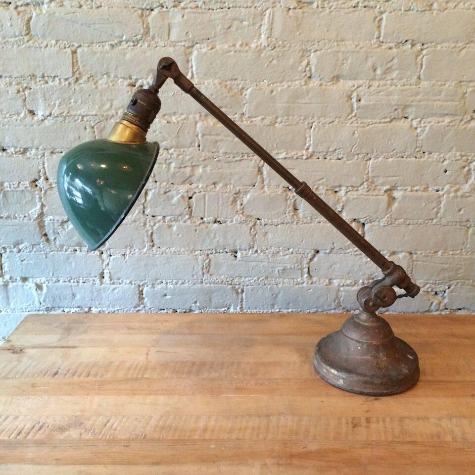 Antique late 19th century Industrial factory brass task lamp with weighed cast iron base by O.C. White, with telescopic arm the extends from 15