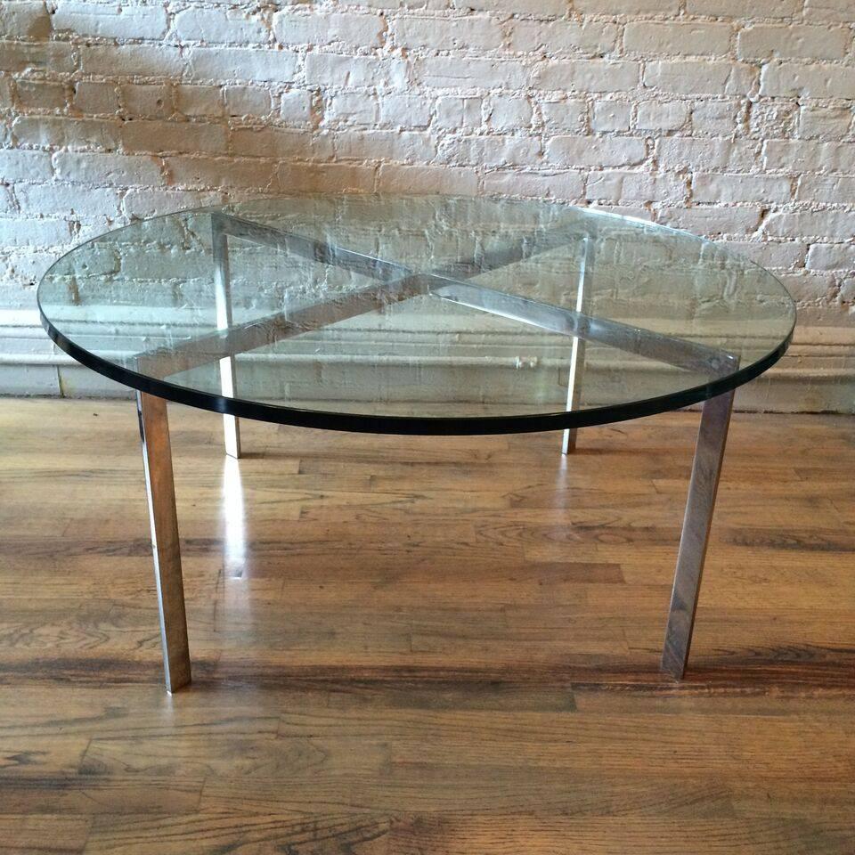 Mid-Century Modern, chrome, x-base, coffee table with a thick green glass top.