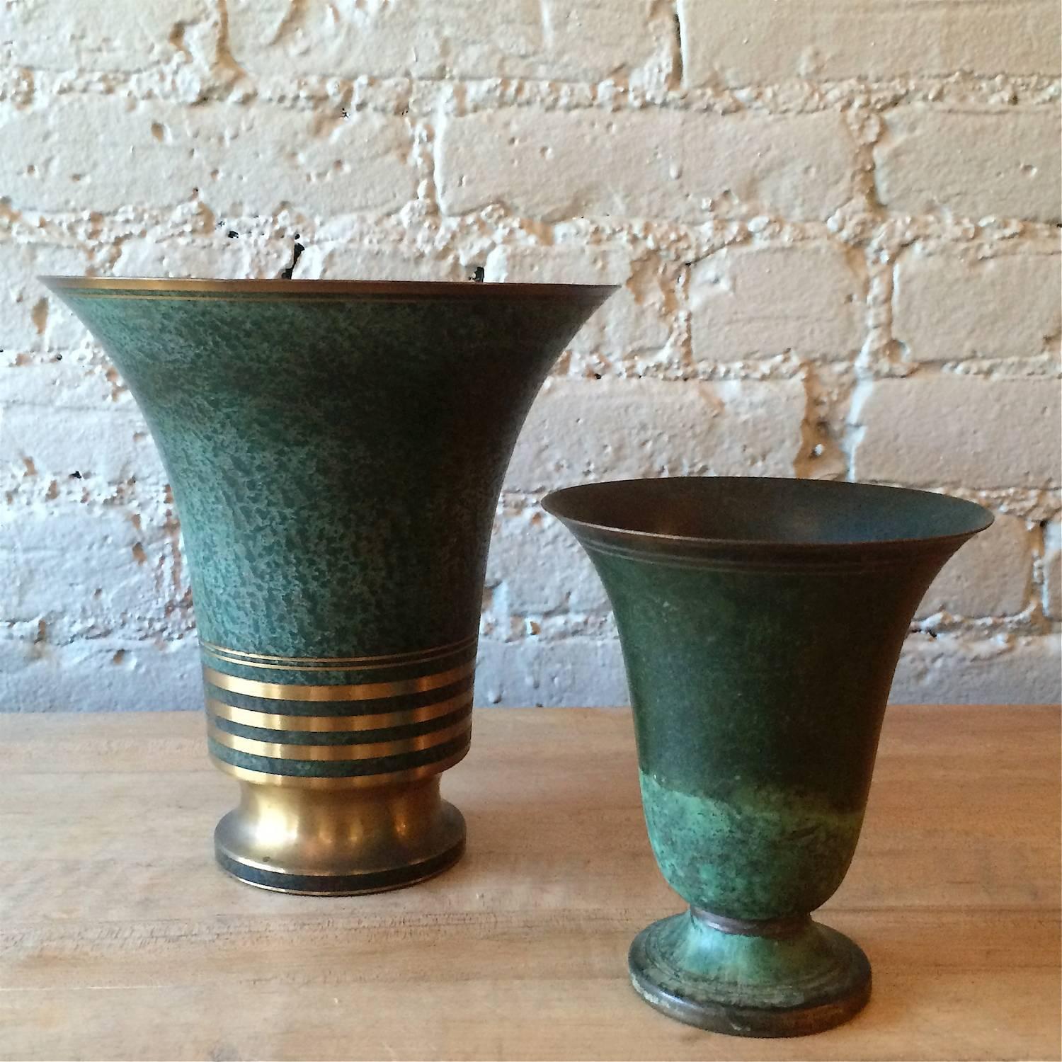 Pair of bronze vases with verdigis patina designed by Carl Sorensen, circa 1940s. Both vases are signed.

Large vase: 7in d x 8in ht

Small vase: 5in d x 6in ht.