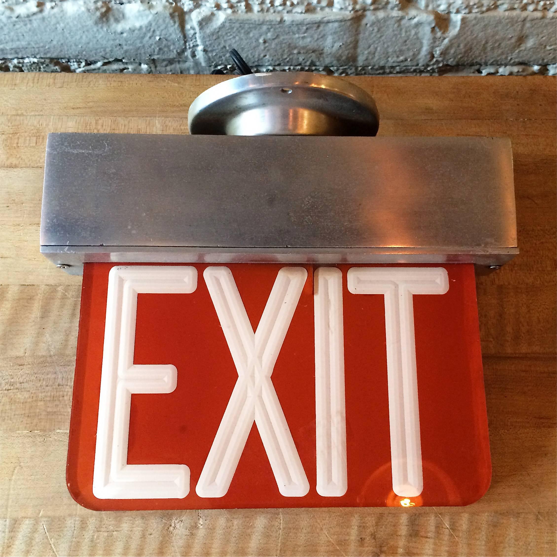 Mid-Century, double-sided, ceiling flush mount, exit sign light is machined aluminum and etched Lucite, circa 1960s.