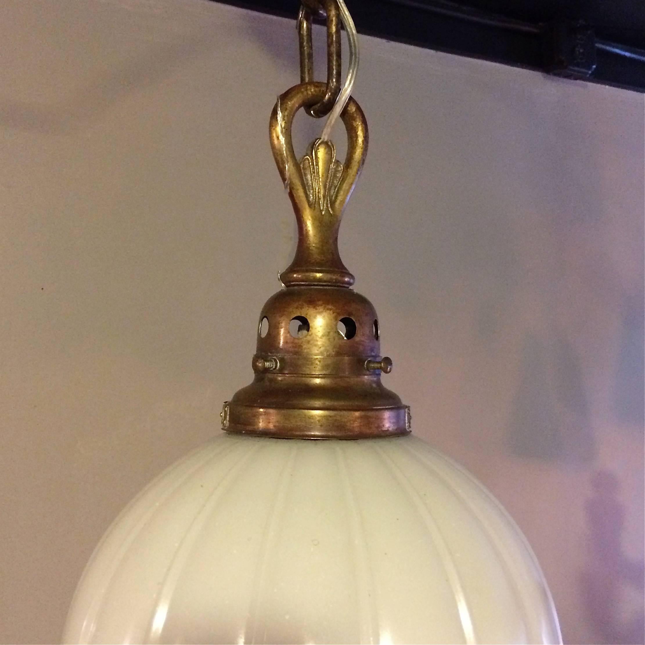 Industrial Ribbed Milk Glass and Brass Library Globe Pendant Light In Good Condition In Brooklyn, NY