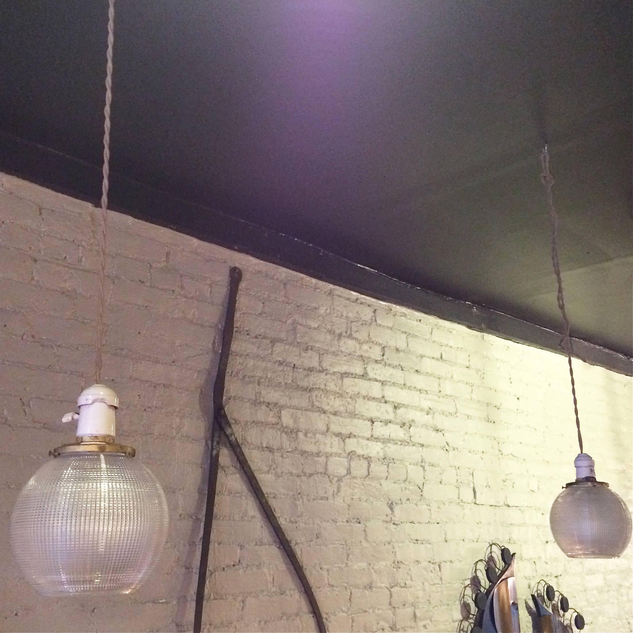 Pair of Holophane Glass Open Globe Pendant Lights In Excellent Condition In Brooklyn, NY