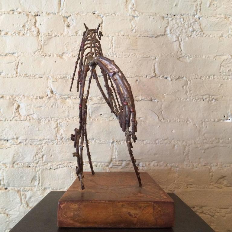 Mid-Century, abstract, Brutalist, horse sculpture by Marcello Fantoni for Raymor is a mixed metal wire sculpture mounted on a walnut base with copper label signed Fantoni Italy for Raymor, 1958.